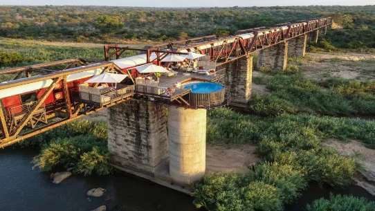 Kruger Shalati, converted train carriages on the railway bridge over the Sabie River